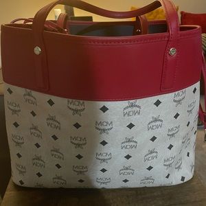 Gently used MCM signature brand leather shopper bag with pouch.